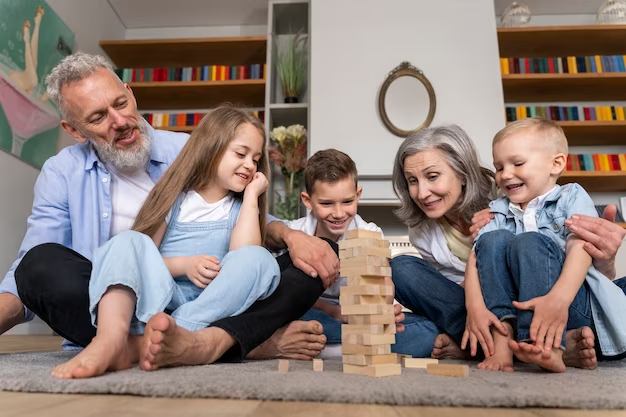 Image of a family of five members playing Jenga together