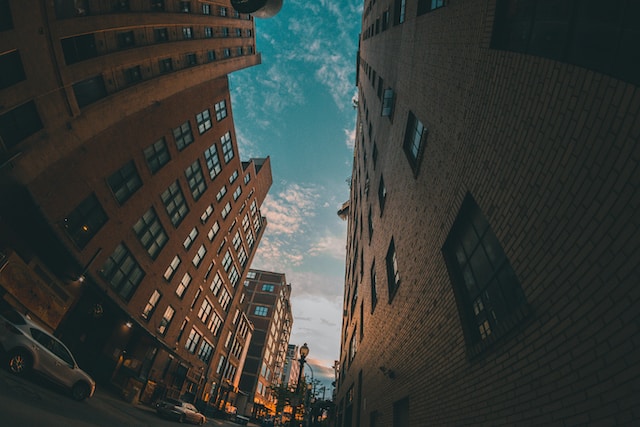 low-angle photo of street between two buildings