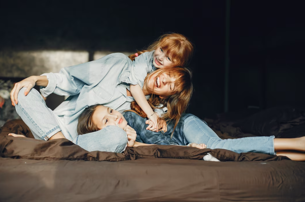 Mother with daughters at home