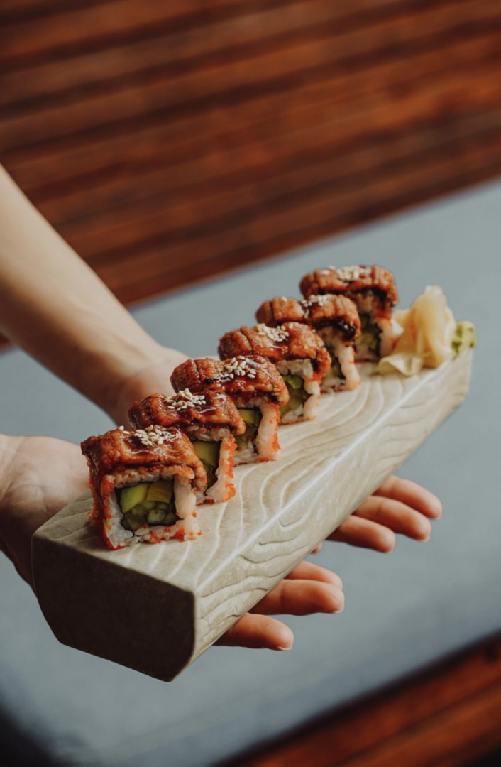 serving sushi on the board.